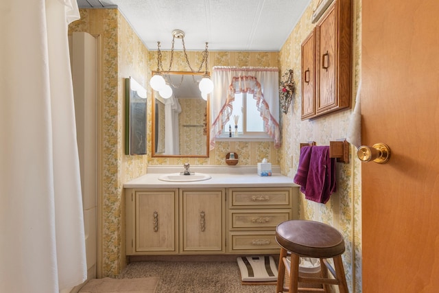 bathroom with vanity and a textured ceiling