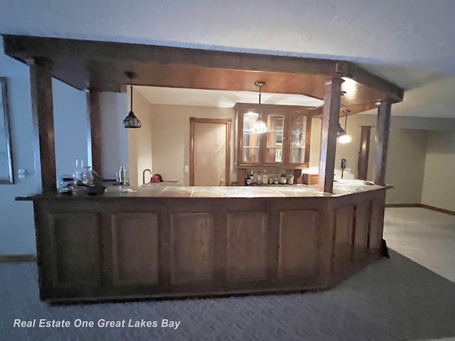 bar with hanging light fixtures