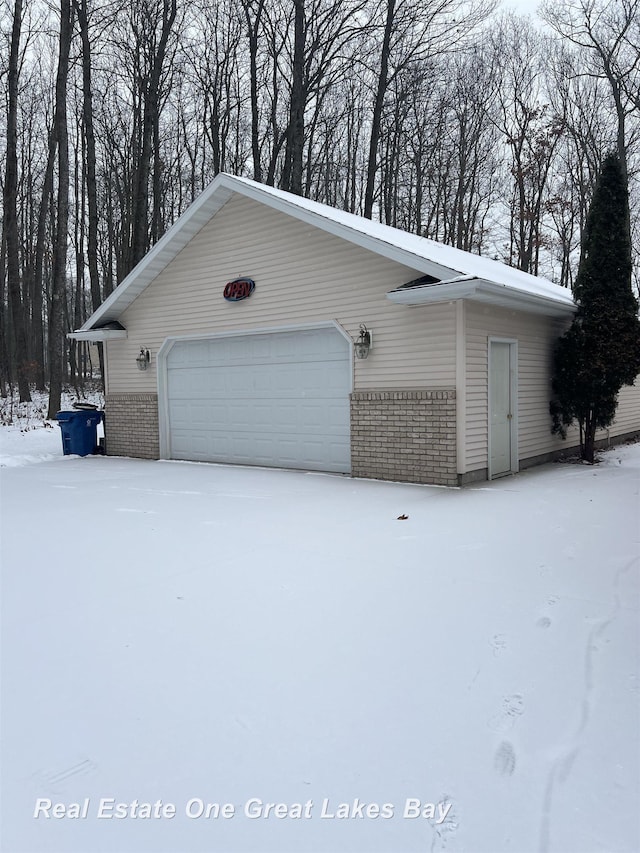 view of snow covered garage