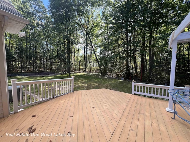 wooden terrace with a yard