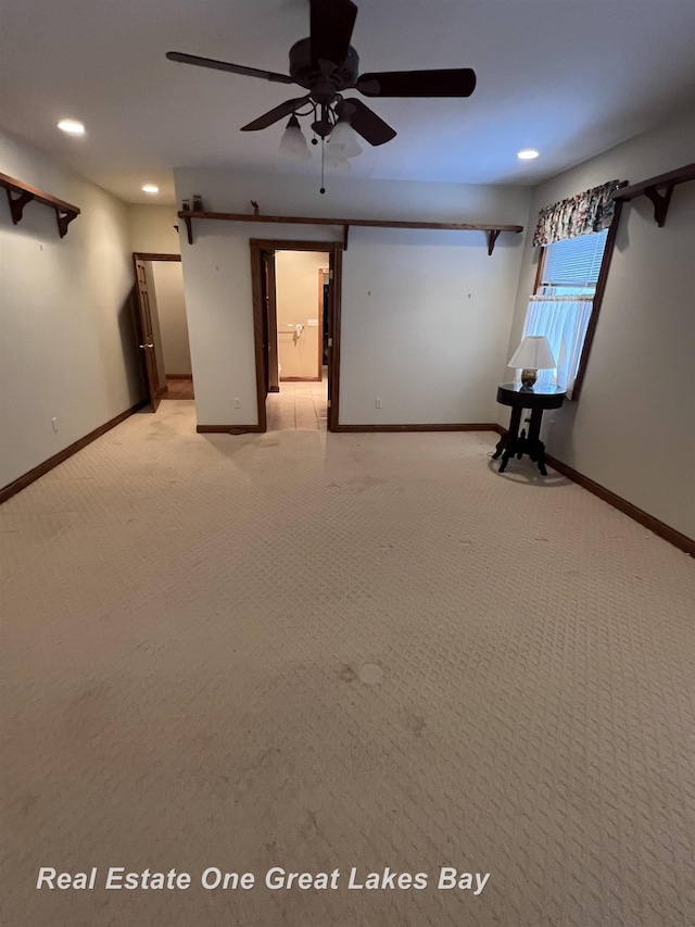 interior space featuring ceiling fan