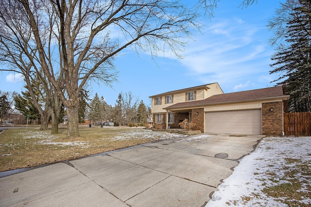 front facade featuring a garage and a yard