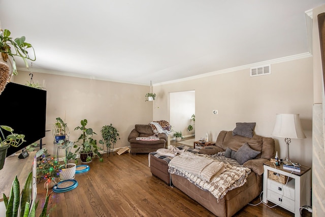 living room featuring crown molding and dark hardwood / wood-style floors