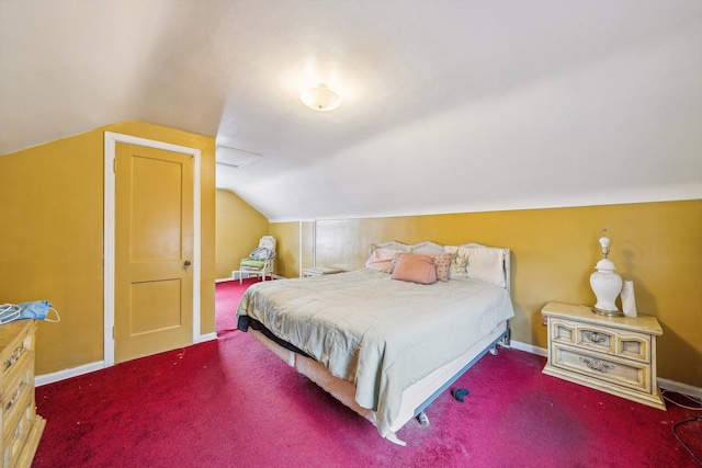 carpeted bedroom featuring lofted ceiling