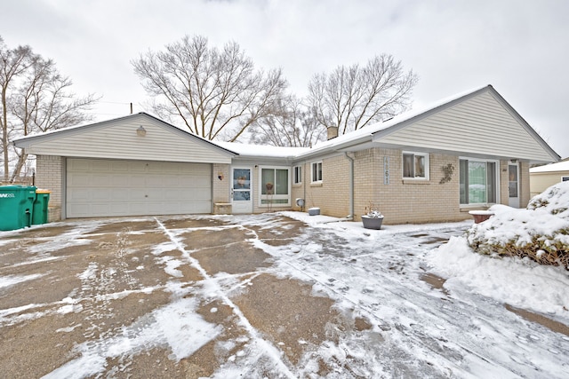 single story home with a garage