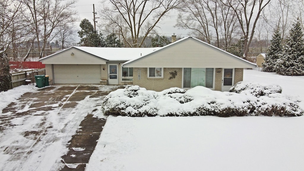 single story home featuring a garage