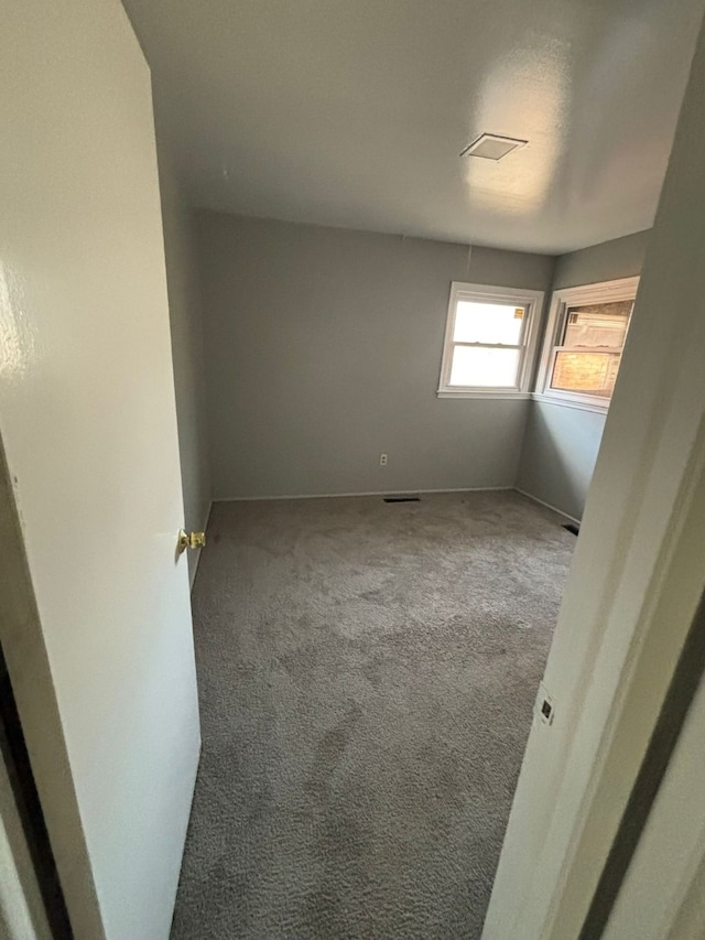 unfurnished room with carpet