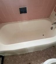 bathroom with toilet and tile patterned floors