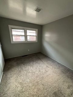 spare room with carpet flooring