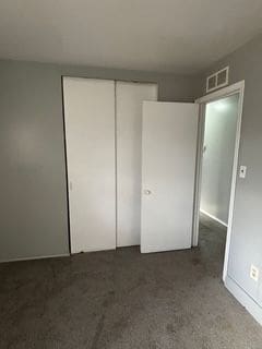 unfurnished bedroom with a closet