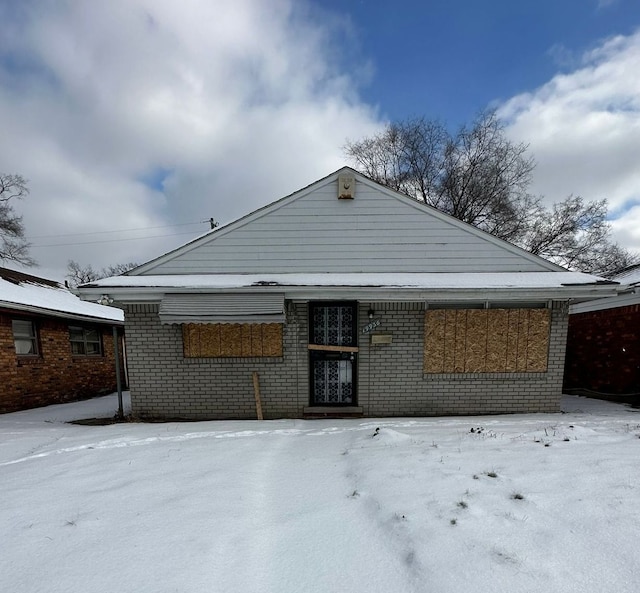 view of snow covered house