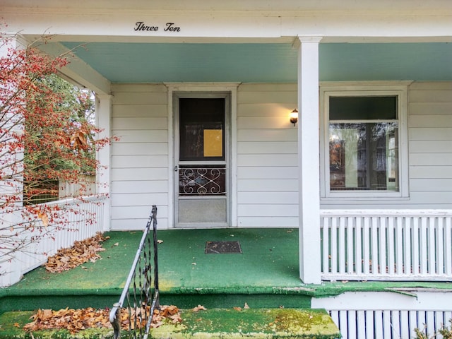 doorway to property featuring a porch