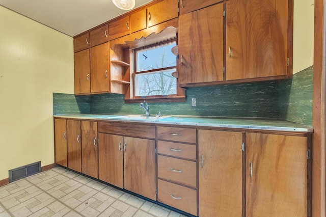 kitchen with sink and backsplash