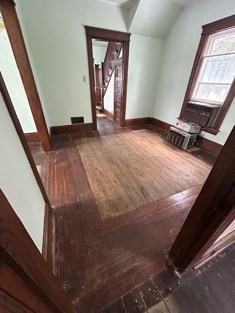 additional living space with wood-type flooring