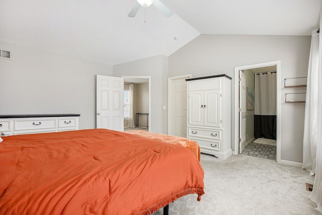 carpeted bedroom with lofted ceiling, ensuite bath, and ceiling fan