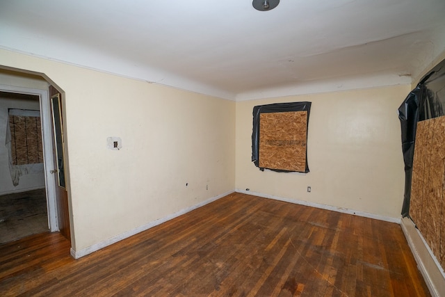 spare room with dark hardwood / wood-style flooring