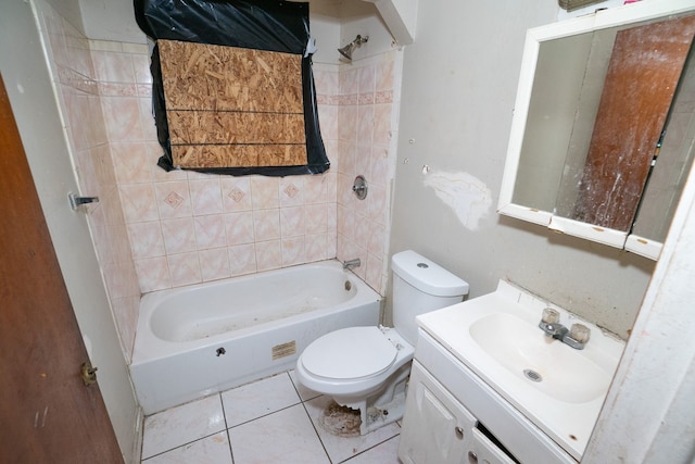 full bathroom featuring tile patterned floors, vanity, toilet, and tiled shower / bath combo