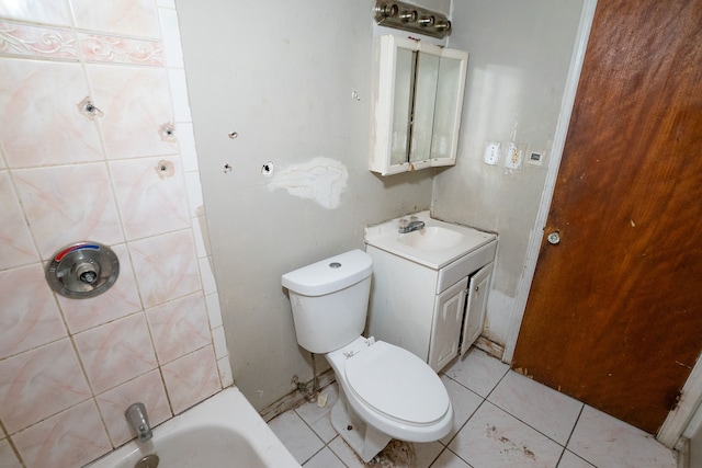 bathroom featuring tile patterned floors, a tub, vanity, and toilet