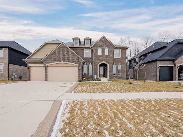 view of front of house featuring a garage and a lawn