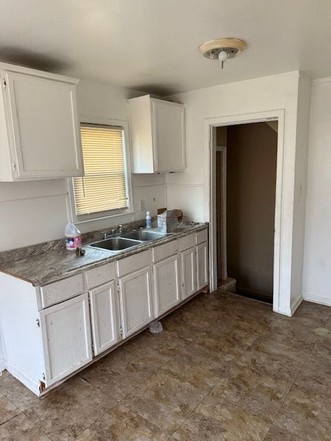 kitchen with sink and white cabinets