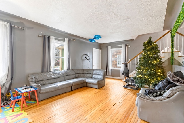 living room featuring hardwood / wood-style floors and a textured ceiling