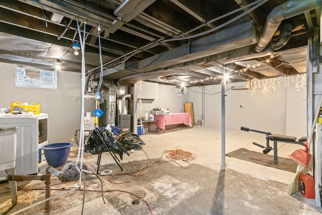 basement with washer / dryer, heating unit, and water heater