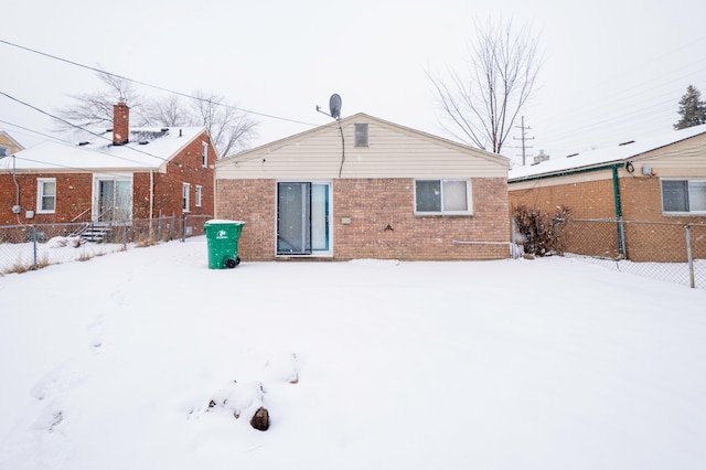 view of snow covered house