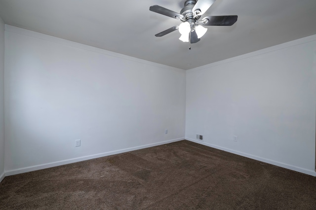 carpeted spare room with crown molding and ceiling fan