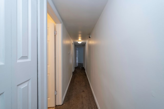 hall with dark carpet