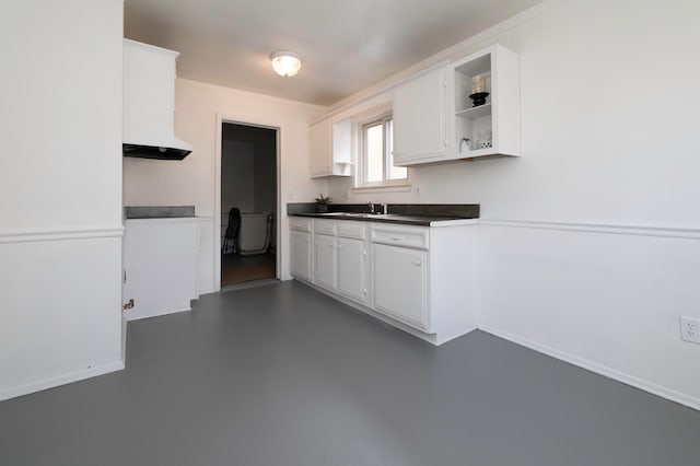 kitchen featuring sink and white cabinets