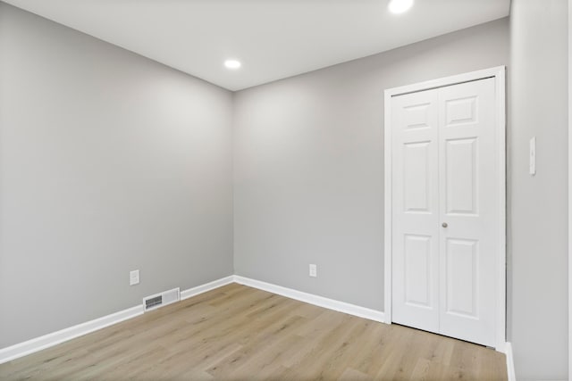 unfurnished room featuring light hardwood / wood-style floors