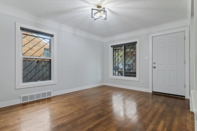 foyer with dark hardwood / wood-style flooring