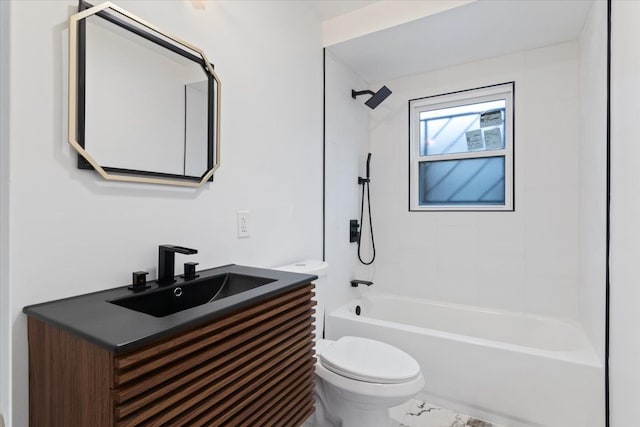 full bathroom featuring tiled shower / bath, vanity, and toilet