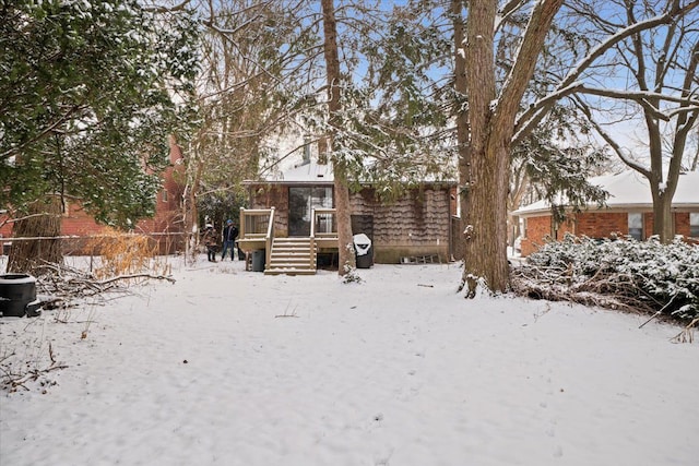 view of yard layered in snow