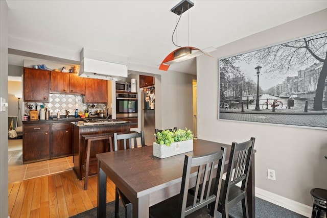 dining space featuring hardwood / wood-style floors