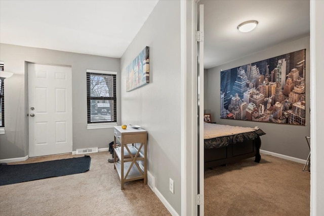 view of carpeted foyer