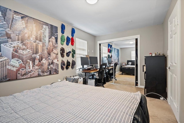 bedroom with light carpet, a closet, and multiple windows