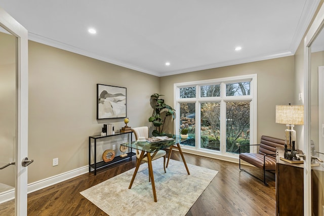 office space with a healthy amount of sunlight, dark hardwood / wood-style floors, and ornamental molding