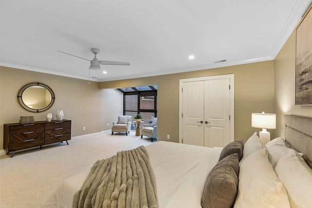 bedroom with carpet flooring, ceiling fan, and crown molding