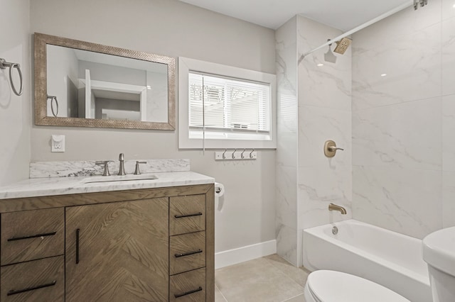 full bathroom featuring toilet, tile patterned flooring, tiled shower / bath combo, and vanity