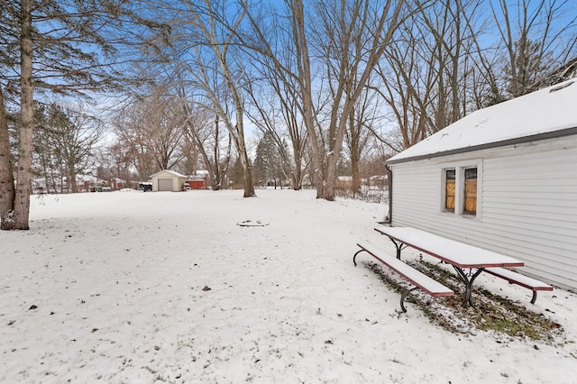 view of yard layered in snow