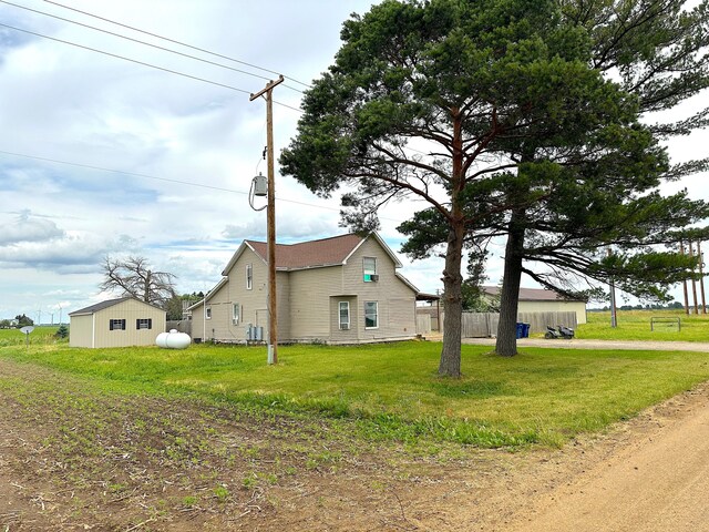 view of home's exterior with a lawn