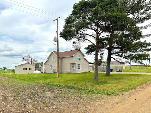 view of home's exterior with a lawn