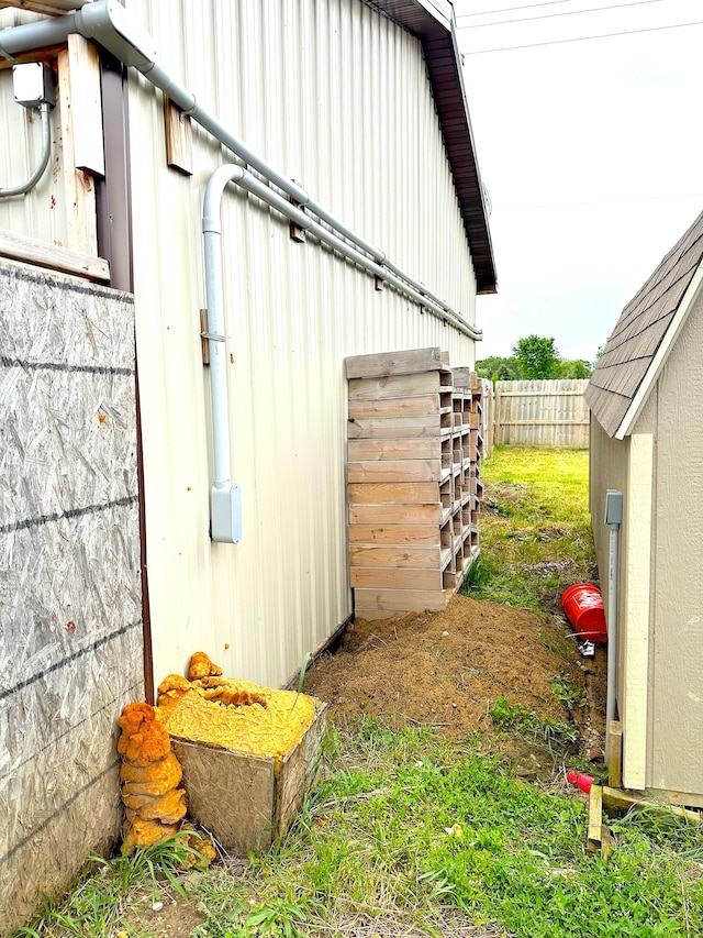 view of side of home with an outdoor structure