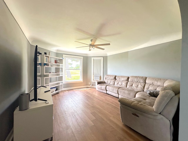 living room with hardwood / wood-style flooring and ceiling fan