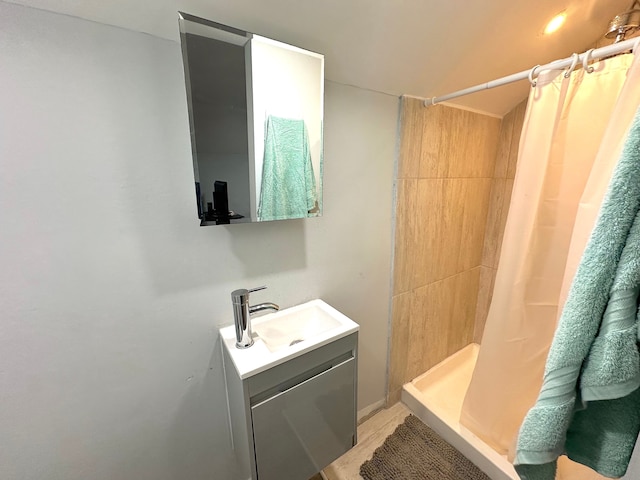 bathroom featuring vanity and walk in shower