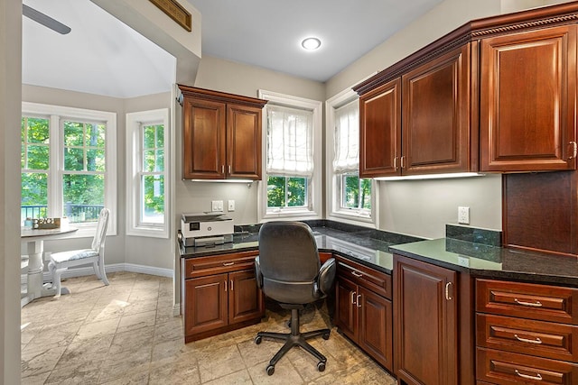 home office featuring built in desk and a wealth of natural light