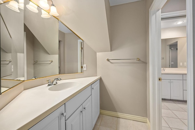 bathroom with tile patterned floors and vanity