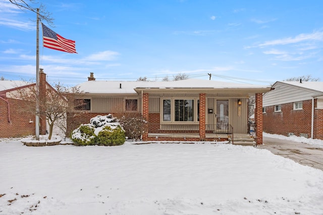 single story home with covered porch