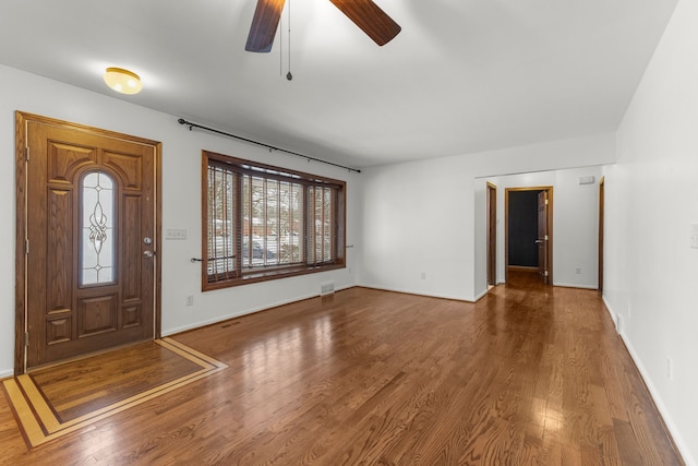 foyer with ceiling fan and hardwood / wood-style floors